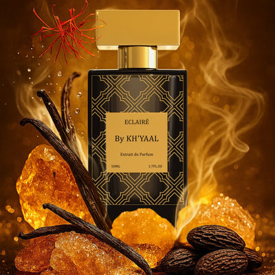 Perfume bottle labeled 'Eclaire by Khyaal' with vanilla beans and amber on a warm background